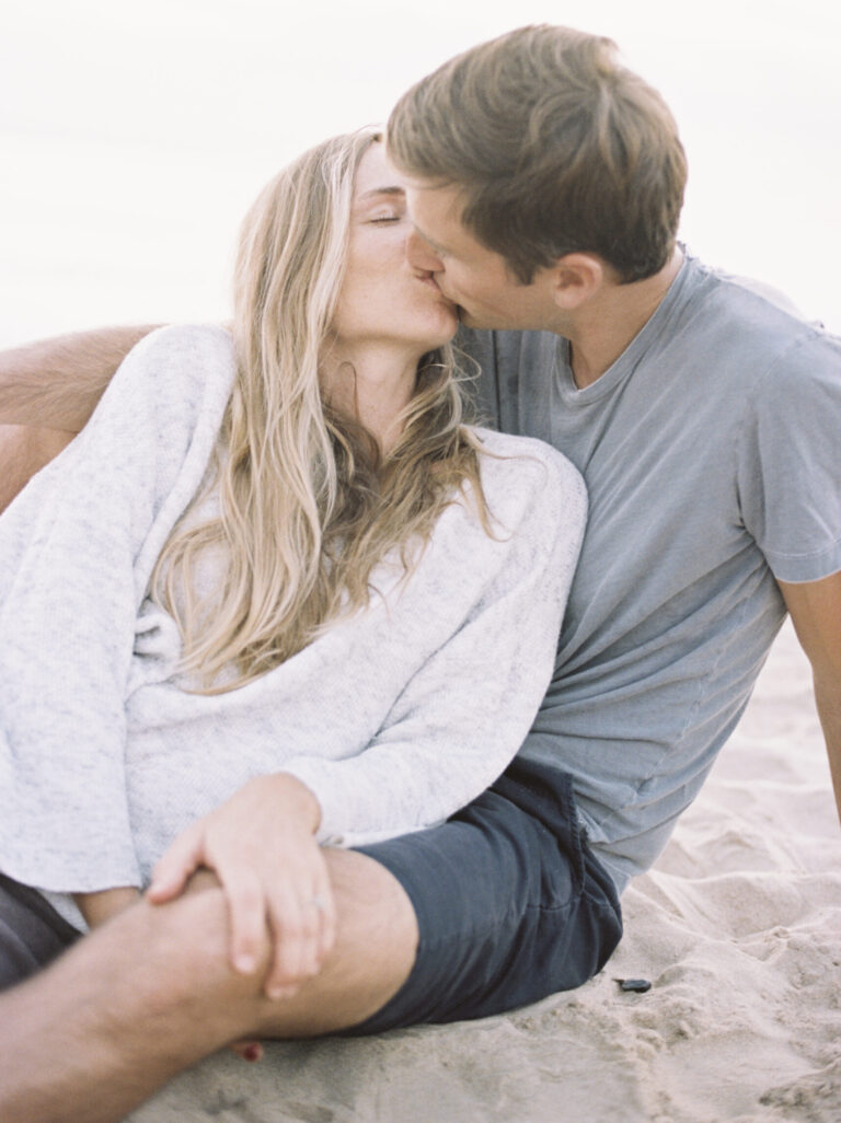 a-couple-kissing-on-a-beach-2022-03-04-02-40-24-utc