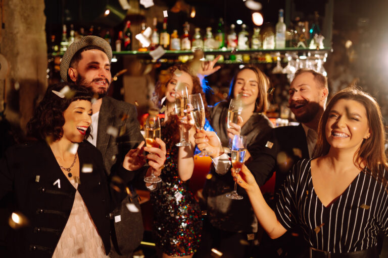 happy-friends-throwing-confetti-jumping-while-enj-2022-11-17-23-35-47-utc