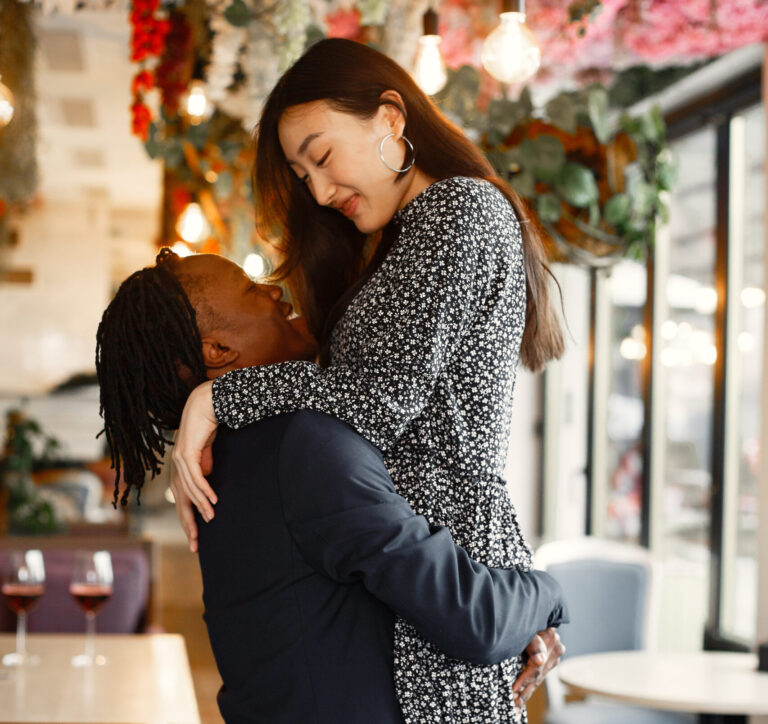 mixed-couple-celebrating-their-engagement-in-a-caf-2021-08-31-16-02-27-utc