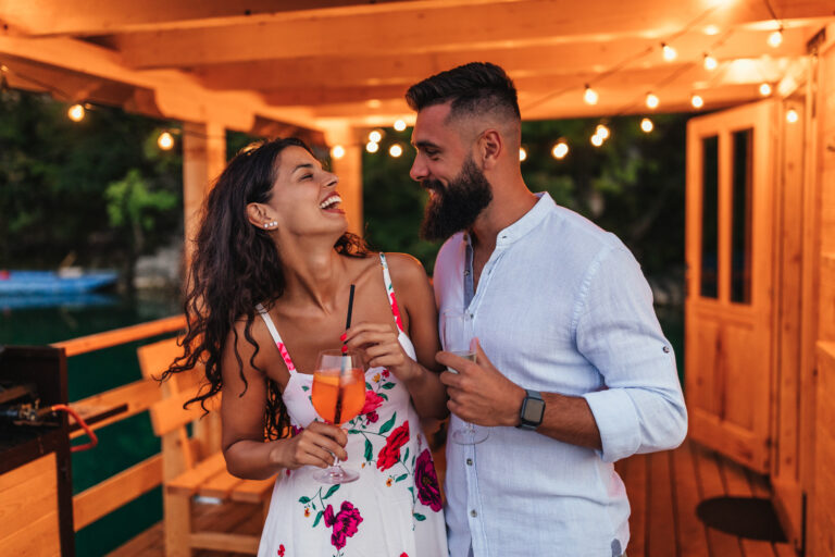 smiling-couple-celebrating-with-wine-2023-02-15-20-32-20-utc