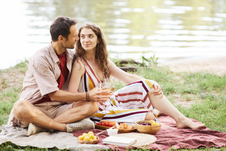 young-couple-enjoying-romantic-picnic-outdoors-2021-12-09-16-08-48-utc